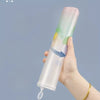 A hand holds a transparent pink A4 zipper file bag with colorful accents against a light blue background.