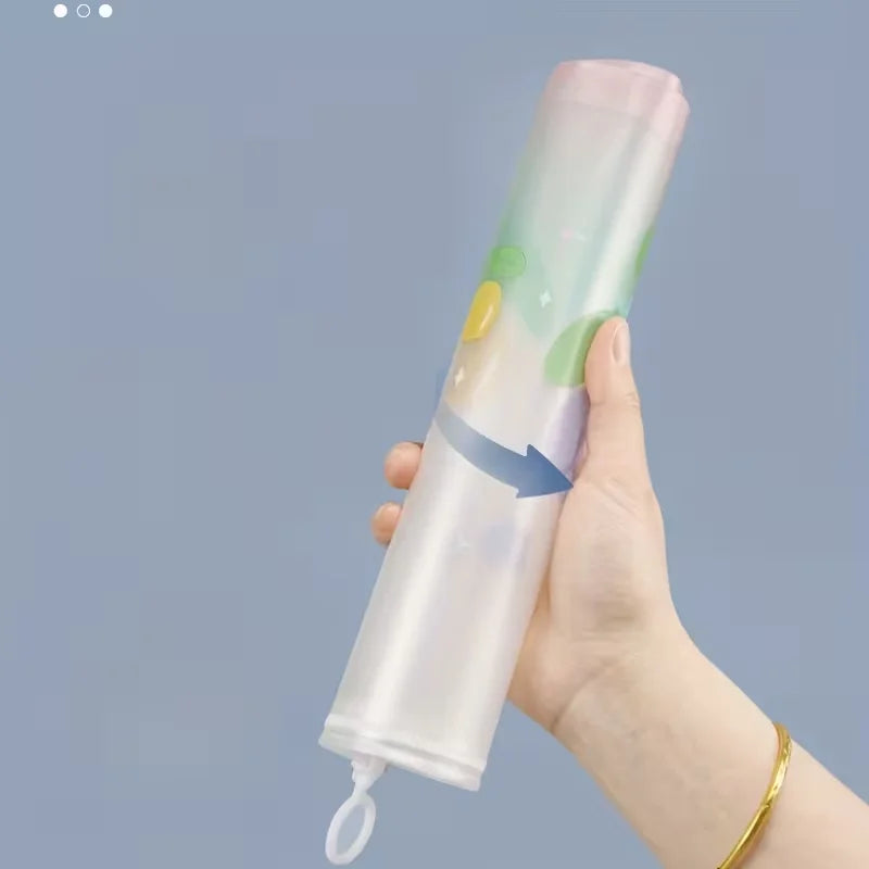A hand holds a transparent pink A4 zipper file bag with colorful accents against a light blue background.