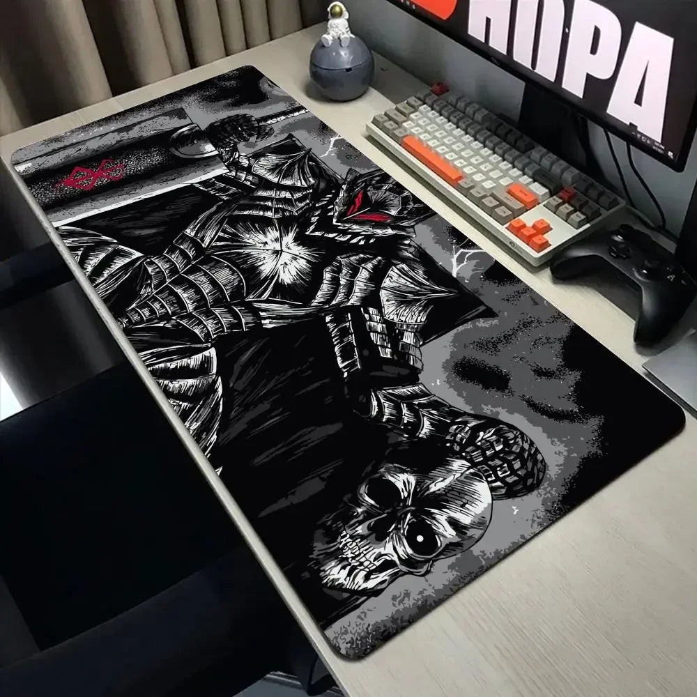 A large black and white Berserk anime mouse pad is displayed on a desk next to a mechanical keyboard and gaming mouse.