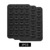 A pack of nine black silicone suction phone mounts arranged in a grid.