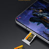 A smartphone displaying a game, next to two Kodak high-speed SD memory cards.