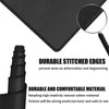 Black mouse pad with stitched edges and a magnifying glass showing durable material texture
