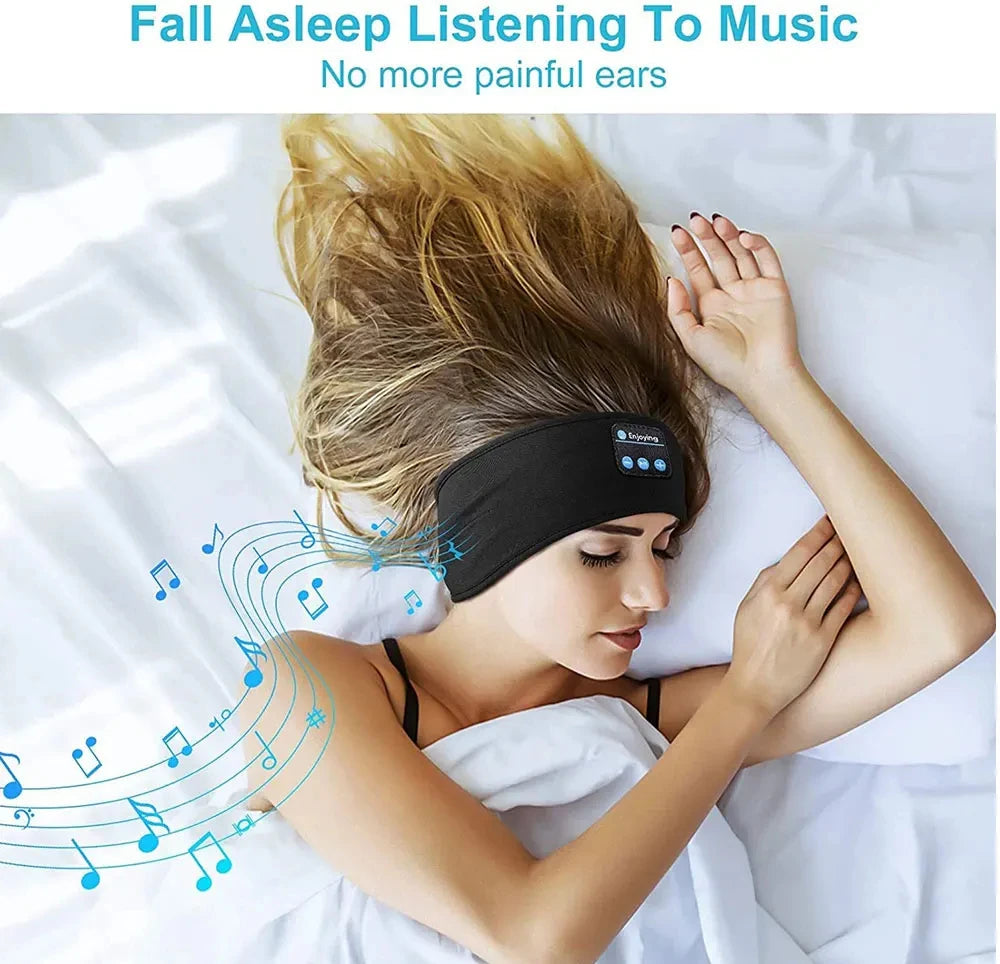 A woman is sleeping with a black headband device on her forehead, listening to music.