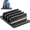 A black laptop stand organizer holding three smartphones vertically.