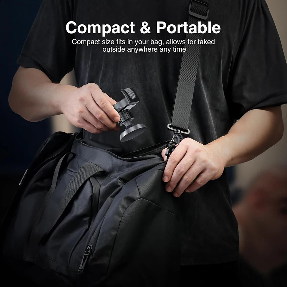 A person holds a compact magnetic phone holder for gym and fitness in a black bag.