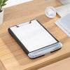A black A4 waterproof file box with a writing board and pen slot resting on a wooden desk.