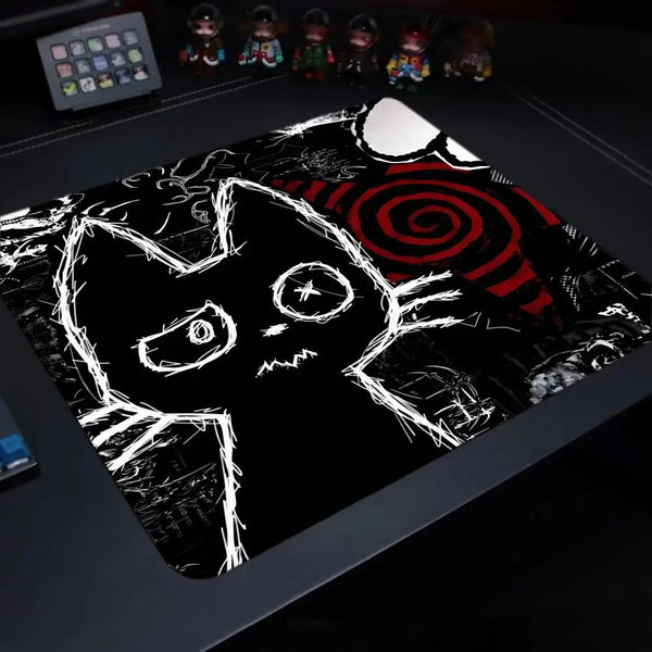 A black cat silhouette design printed on a large mouse pad with a non-slip rubber base.