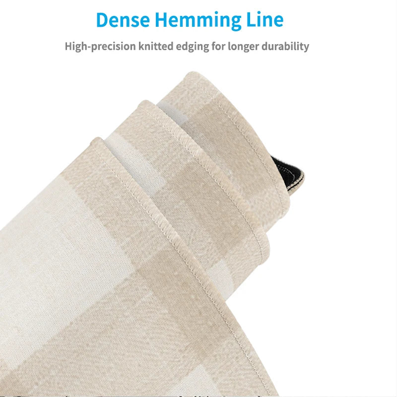 Close-up of a beige plaid fabric showing a dense hemming line detail.