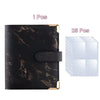 A black faux marble photo album binder with gold accents and 25 blank clear photo pages.