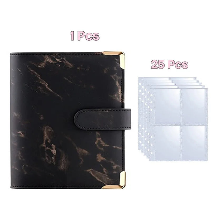 A black faux marble photo album binder with gold accents and 25 blank clear photo pages.