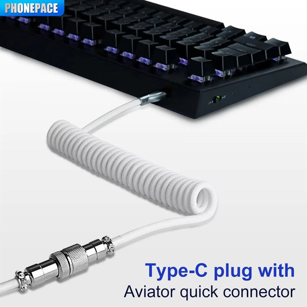 A Type-C plug with an Aviator quick connector cable shown next to a mechanical keyboard.
