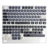A clear acrylic mechanical keyboard featuring blue and gray PBT keycaps with a sea theme.