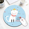 A round blue mouse pad featuring a white cat crown design and the text I am a sweet prince.