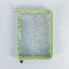 A green A5 sticker organizer binder with clear storage pockets filled with various star-shaped stickers.