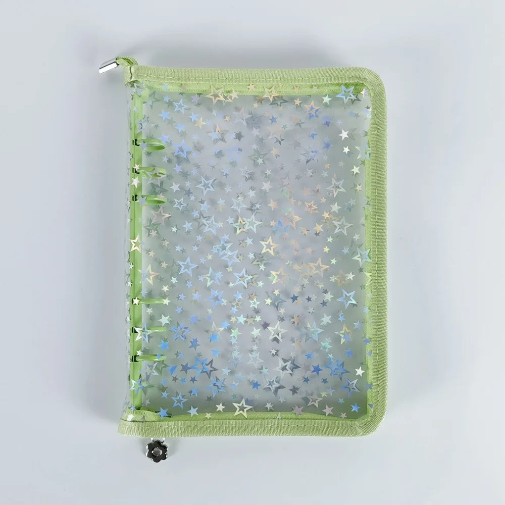 A green A5 sticker organizer binder with clear storage pockets filled with various star-shaped stickers.