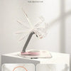 A clear acrylic angle adjustment stand demonstrating 360 degree and 180 degree angle adjustments for a tablet or phone.