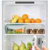A hand holds a white handheld USB rechargeable heat sealer bag with fresh produce inside a refrigerator drawer.