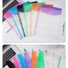 A showcase of loose-leaf file bags containing colorful plastic expanding envelopes with snap buttons.
