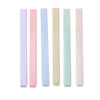 A set of six lip balms in pastel shades of pink, purple, and mint green.