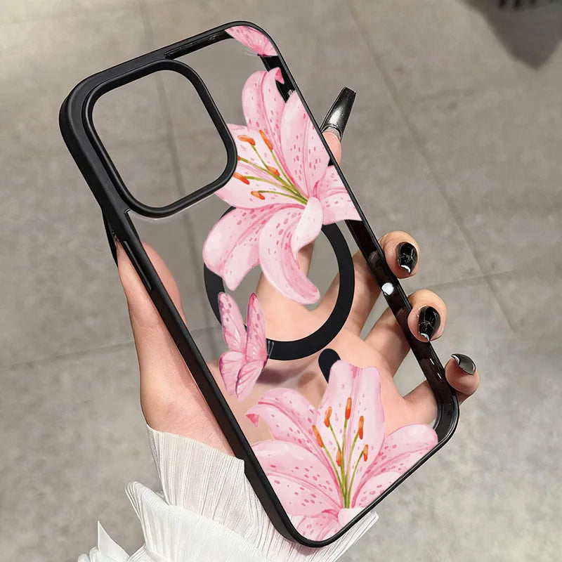 A hand holds a pink lily floral transparent iPhone case with a shockproof bumper.