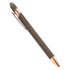 A close-up view of a retractable stylus and ballpoint pen with a dark gray body and gold accents.