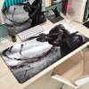 A black and white manga-themed gaming mousepad featuring an illustration of Miyamoto Musashi.