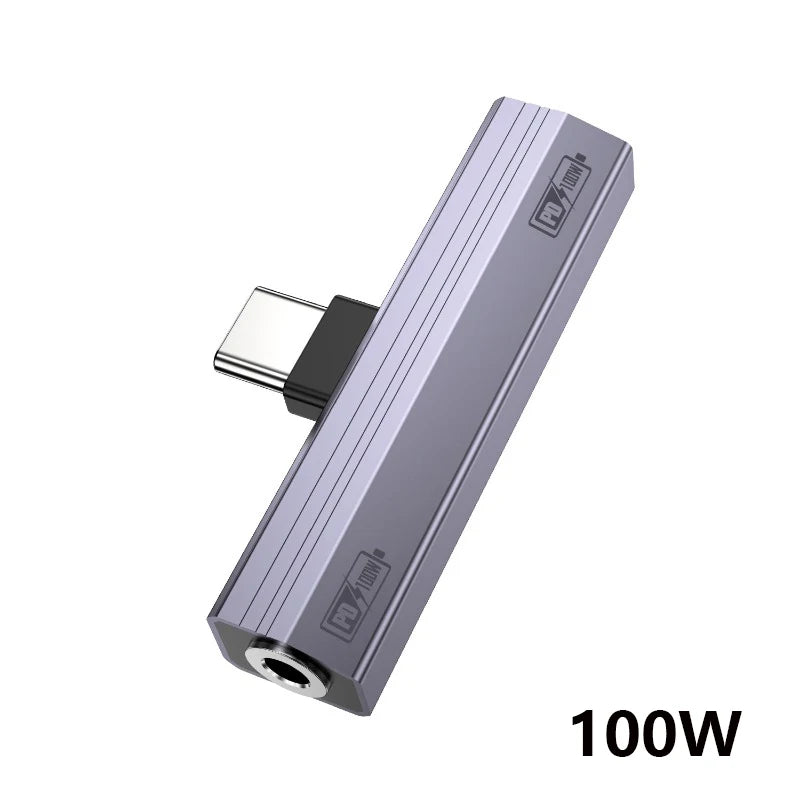 A silver USB-C to 3.5mm audio adapter with a protective cover and 100W power rating.