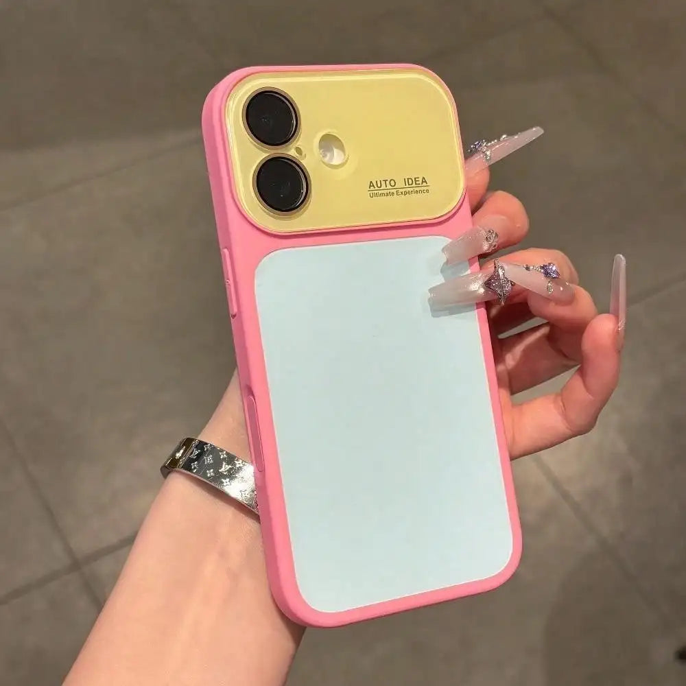 A hand holds a pink phone case with a yellow back and light blue front, featuring full lens protection.