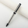 A silver and black metal ballpoint pen is shown diagonally on a white surface.