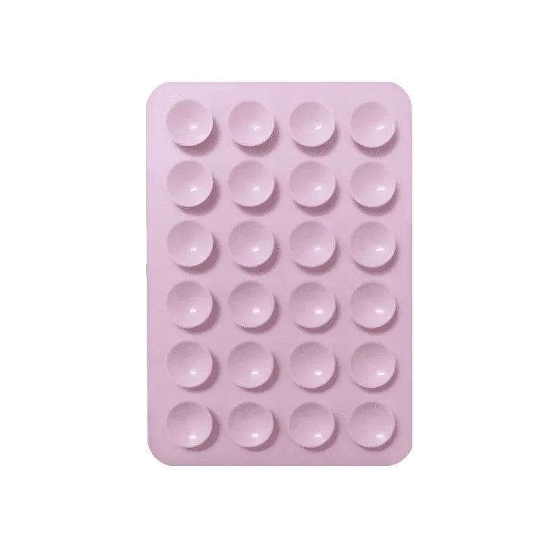 A pink silicone suction cup product featuring a grid of twenty-four round cups.