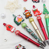 A set of decorative beaded ballpoint pens featuring Christmas and festive designs.