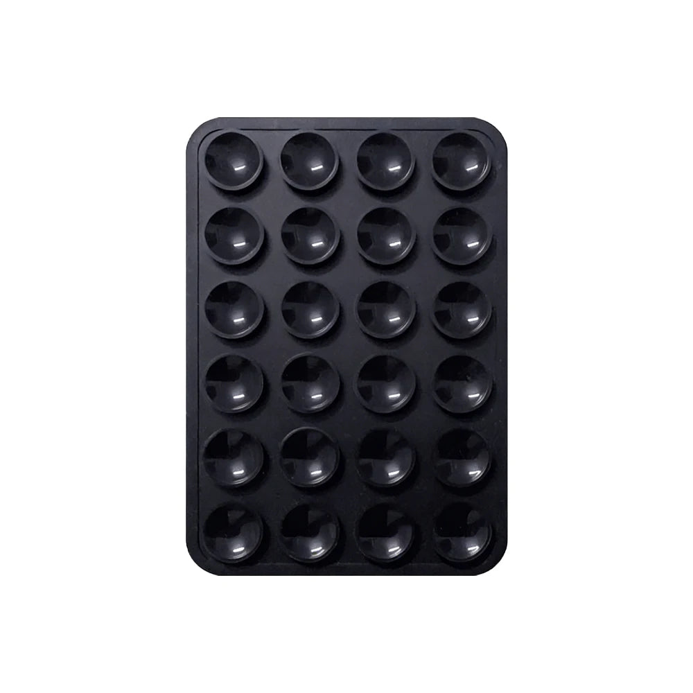 Black reusable silicone suction phone mount with multiple holes for secure attachment