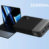 A black 20000mAh power bank is shown next to an Apple laptop, a smartphone, and a tablet.