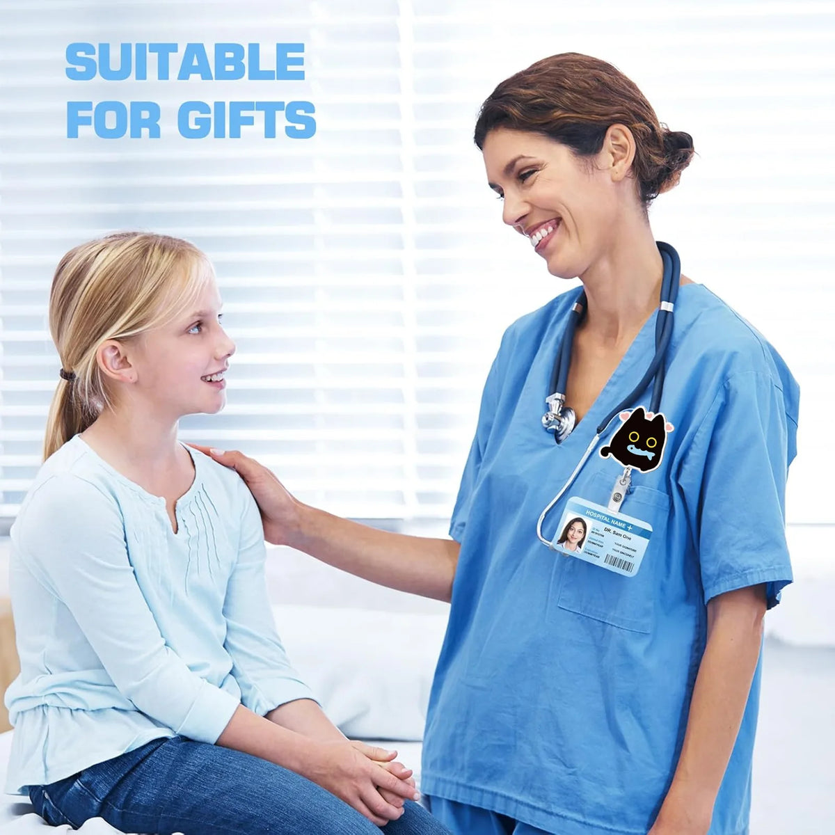 A female doctor in blue scrubs smiles while adjusting the ID badge holder for a young girl.