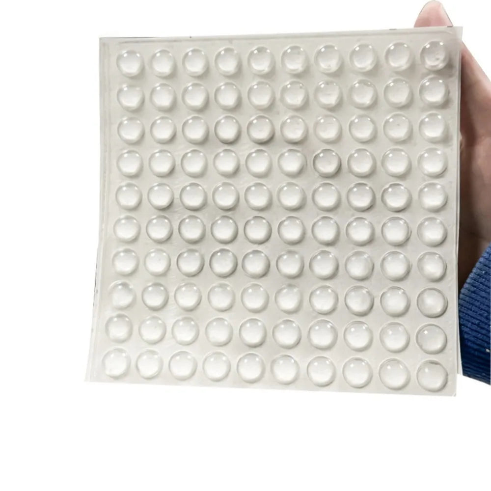 A clear silicone sheet with multiple round stickers designed for long nails.