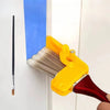A yellow precision corner paint brush is shown applying blue paint to a white wall surface.