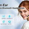 A smiling woman wearing open ear wireless Bluetooth headphones with a microphone.