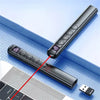 A black presentation pen pointer with a red light remote is shown next to a laptop and a USB drive.