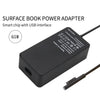 A black surface book power adapter with a USB interface and cable.