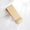 A vintage solid brass money clip with a card holder shown in a golden tone.
