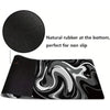 Black gaming mouse pad featuring a liquid wave design and natural rubber for non-slip grip