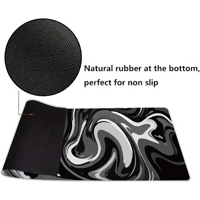 Black gaming mouse pad featuring a liquid wave design and natural rubber for non-slip grip