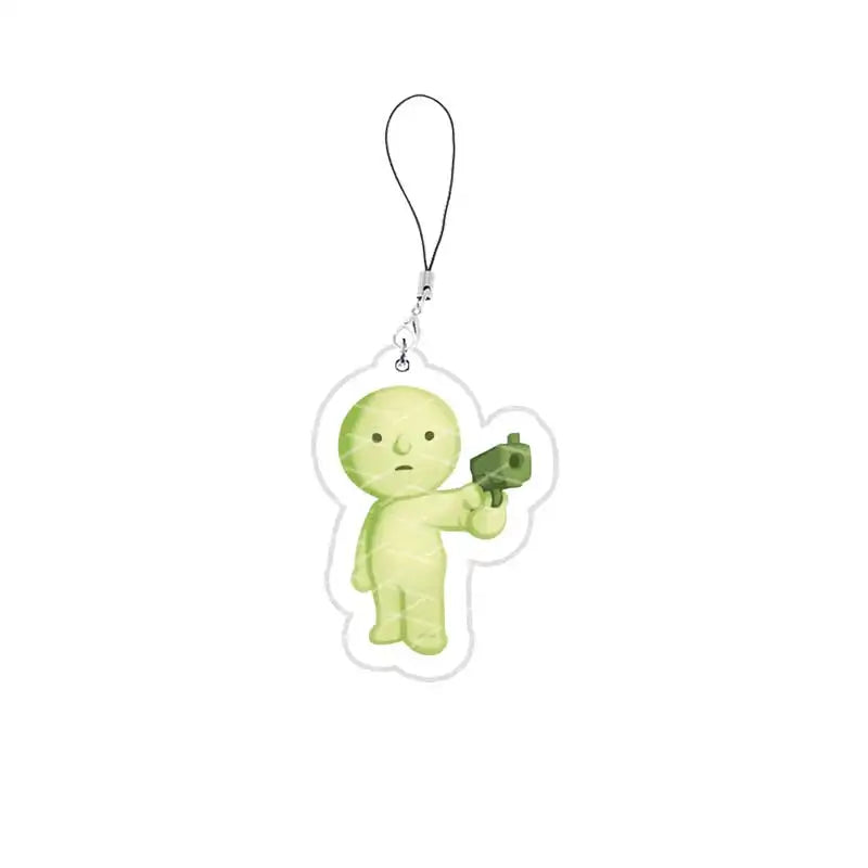 A small, light green, squishy-looking character charm attached to a silver keychain.