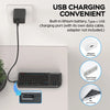 مجموعة لوحة مفاتيح وفأرة لاسلكية سوداء متعددة الوظائف مع منفذ شحن USB بجانب شاحن حائط.