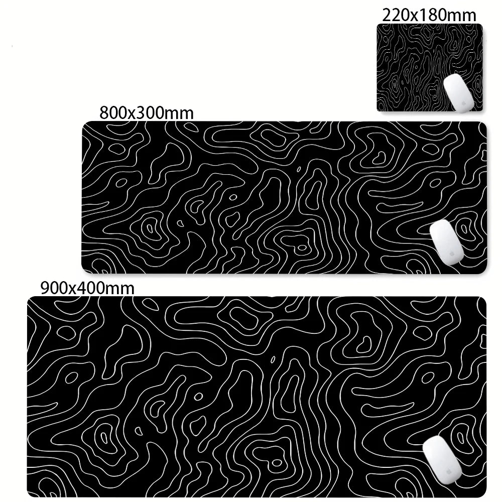Black abstract desk mat with white topographic lines for gaming and office