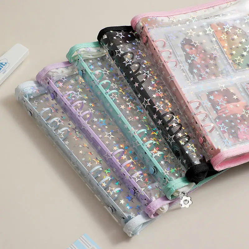 A stack of transparent zipper photo binders in various pastel colors and designs for cards and keepsakes.