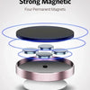 Four permanent magnets used to hold a magnetic car dashboard phone mount.