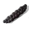 A black ergonomic memory foam wrist rest pad for desk and mouse, shown in profile.