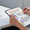 A person is using a stylus to write on an iPad screen, demonstrating glare resistance.
