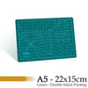 A green SiRo cutting mat with grid guides, double-sided printed, measuring 22x15cm.